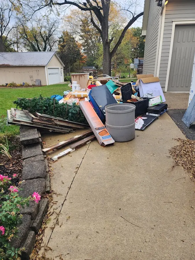Dumpster being loaded with debris for 3 Yard Dumpster Rental in North Laurel
